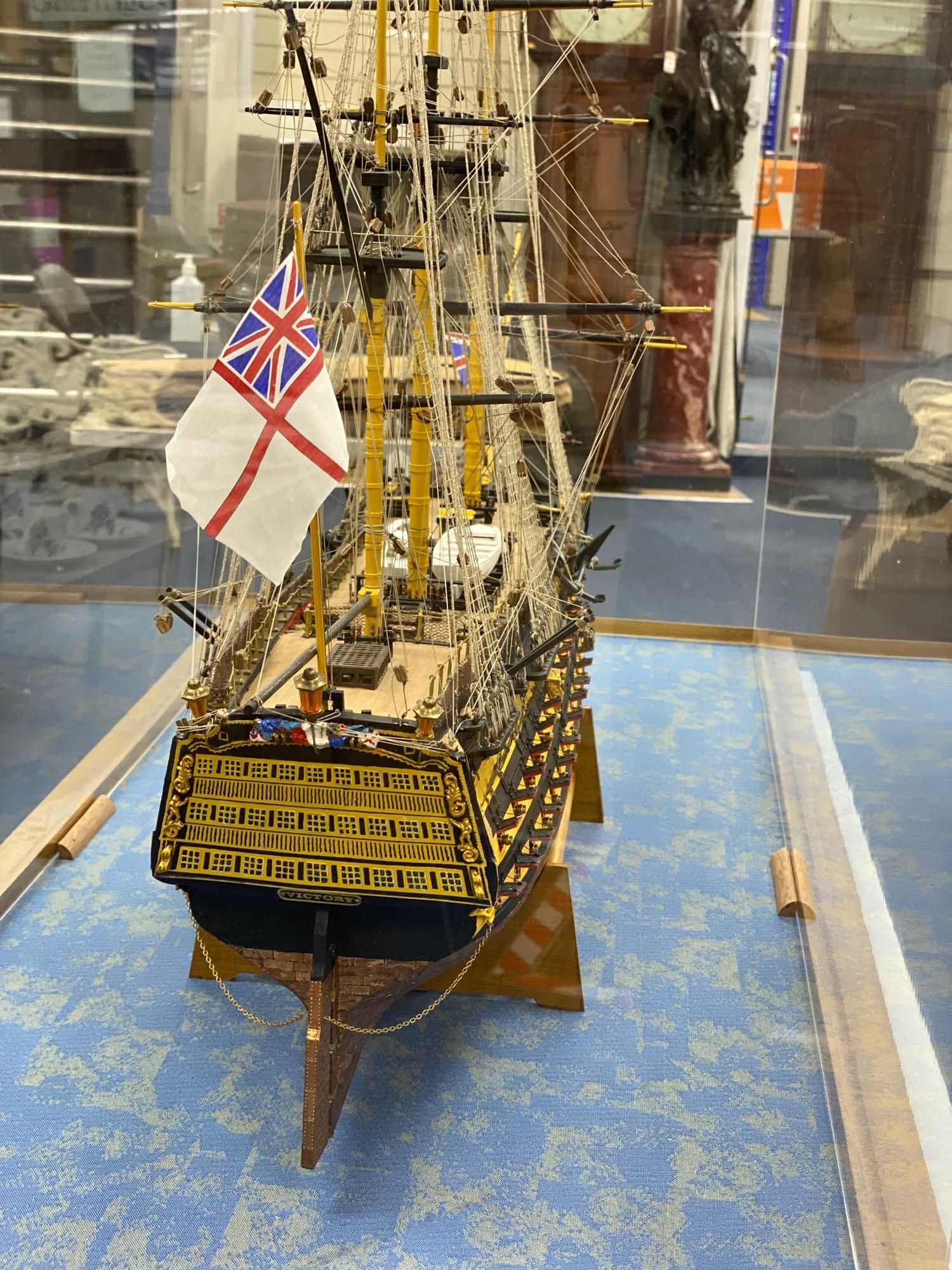A model of the HMS Victory in perspex case, approximate length 120cm